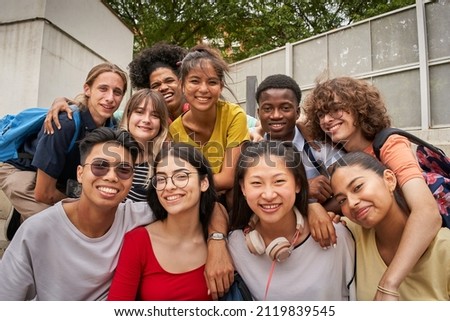 Selfie of a group of students looking at the camera smiling. Happy to be back to school.