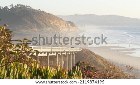Bridge on pacific coast highway 1, Torrey Pines state beach, Del Mar, San Diego, California USA. Coastal road trip vacations, sunset seat scenic vista view point. Roadtrip on freeway 101 along ocean. Royalty-Free Stock Photo #2119874195