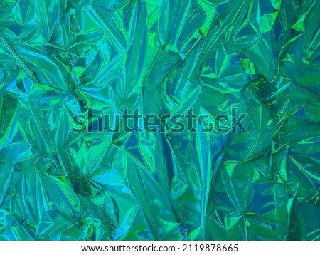 wrinkled plastic sheet
glittering turquoise blue for background