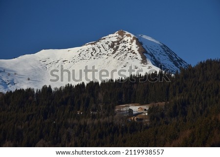 Solitary houses on a mountainside in Morzine, France