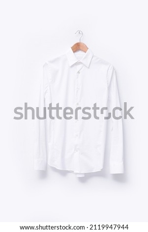 White long sleeves white shirt closeup on hanging
