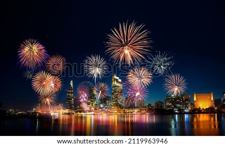 Celebration. Skyline with fireworks light up sky over business district in Ho Chi Minh City ( Saigon ), Vietnam. Beautiful night view cityscape. Holidays, celebrating New Year and Tet holiday Royalty-Free Stock Photo #2119963946
