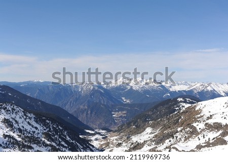Pyrenees mountains range in winter with snowy peaks in Grandvalira ski paradise resort in Andorra