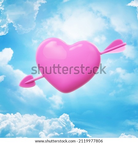 The divine Cupid's arrow pierced someone's heart, against a blue sky with cloud sky Royalty-Free Stock Photo #2119977806