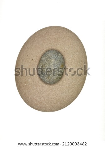 overhead view of two smooth pebbles isolated on white background
