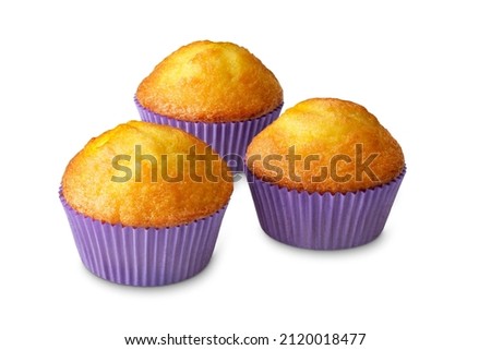 yellow vanilla muffins isolated on white.