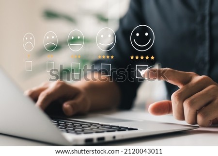 User give rating to service experience on online application, Customer review satisfaction feedback survey concept, Customer can evaluate quality of service leading to reputation ranking of business. Royalty-Free Stock Photo #2120043011