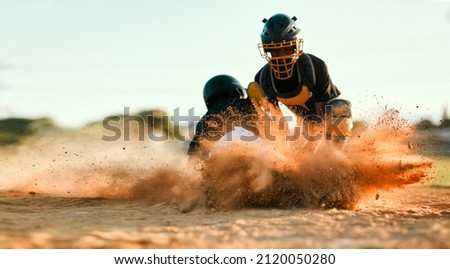 Keep trying until you get it. Shot of a baseball player sliding to the base during a baseball game.