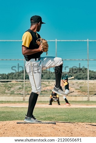 I hope you know how to swing. Shot of a young baseball player getting ready to pitch the ball during a game outdoors.