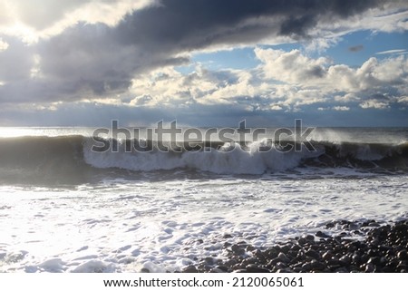 Storm waves on the Black Sea coast. Huge waves under gray skies. Stormy weather