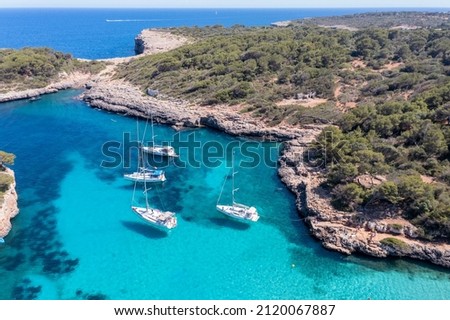 Aerial view, Cala Sa Nau, near Cala d'Or, with beaches and sailing boats, Migjorn region, Mallorca, Balearic Islands, Spain