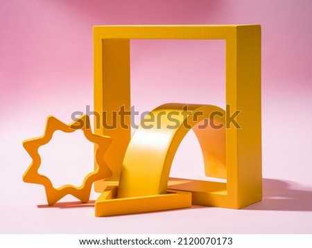 Yellow objects over a pink background