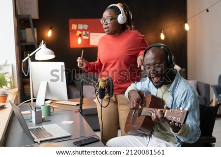 Couple of musicians recording a song