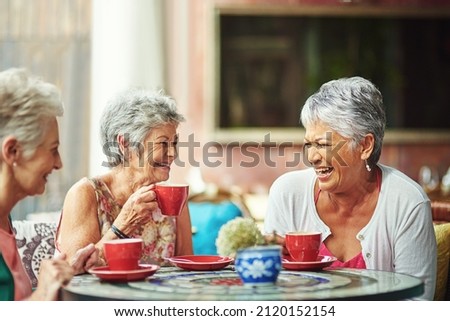 Lifelong friends catching up over coffee. Cropped shot of a group of senior female friends enjoying a lunch date. Royalty-Free Stock Photo #2120152154