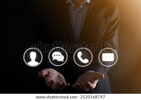 Businessman hand holding,pressing on icon phone, mail, telephone,message,post and person,user. Customer service call center contact us concept.Banner,copy space.Contact Methods