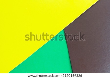 Multicolored background. Three colors on paper. Bright colorful background for design. Rainbow paper.
