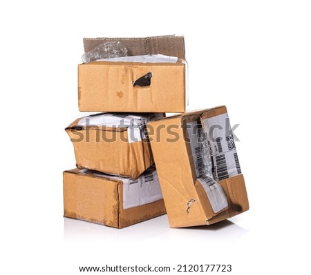 damaged cardboard parcel on white background Royalty-Free Stock Photo #2120177723