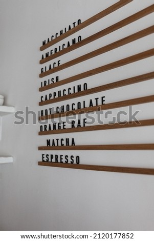 The sign in the cafe, the name of the coffee on the wall