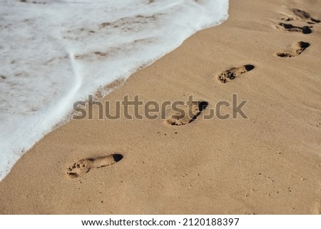 footprint in the sand. Beach travel 