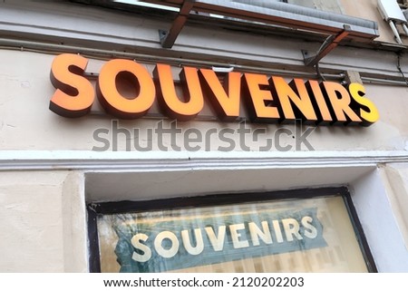 View of glowing souvenirs sign board on wall