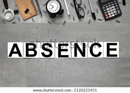 ABSENCE text on white stickers on gray marble background business concept