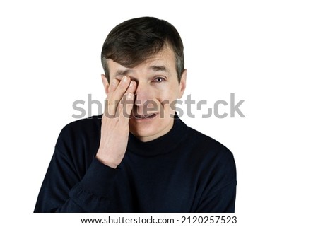 The man on a light background closed one eye with hand and the other eye is very red, the man has conjunctivitis, the man has emotions of suffering and sadness on face, eyes hurt, hard to work