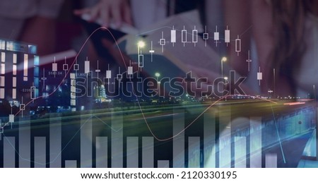 Image of statistics and financial data processing over students reading books. global education and data processing concept digitally generated image. Royalty-Free Stock Photo #2120330195