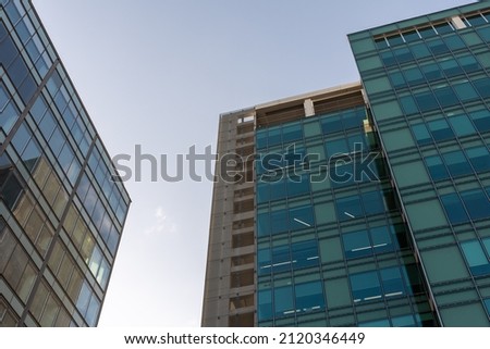 Glass windows of facade modern building in Lisbon city, Portugal Royalty-Free Stock Photo #2120346449