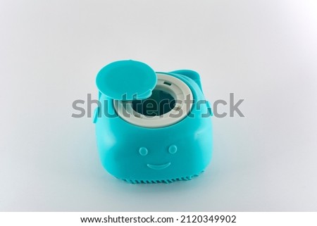Turquoise shampoo holder with applicator type massager for dogs and cats