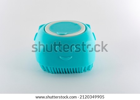 Turquoise shampoo holder with applicator type massager for dogs and cats