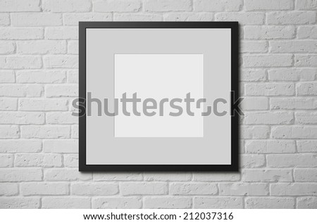 Blank picture frame at the brick wall with copy space and clipping path for the inside