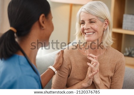 Seeing you healthy makes me so happy. Shot of a doctor having a consultation with a senior woman at home. Royalty-Free Stock Photo #2120376785
