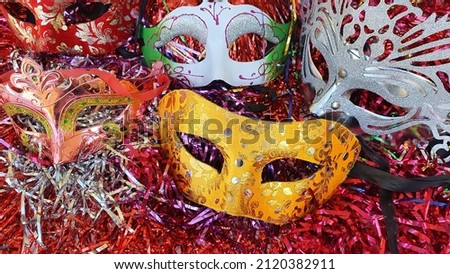 Carnival masks on colored background.