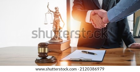 Justice and law concept. Legal and businessman advisor handshake for teamwork, talking, planning analyze investment and marketing at office.  Royalty-Free Stock Photo #2120386979