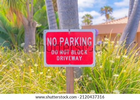 Red signage with no parking do not block driveway at La Jolla, San Diego, California