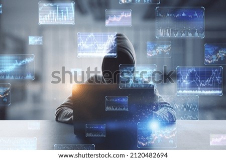 Hacker at desktop using laptop with various forex screens on blurry office interior background. Cryptocurrency, hacking, bticoin trading and finance concept. Double exposure