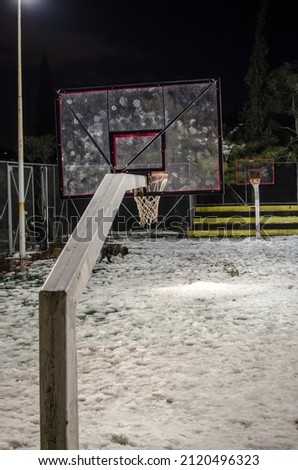 A snow-covered basketball court after a night winter blizzard