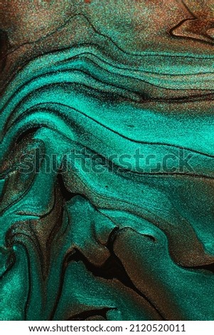 Abstract background from shimmer nail lacquer,chocolate and turquoise colors.Vertical orientation.