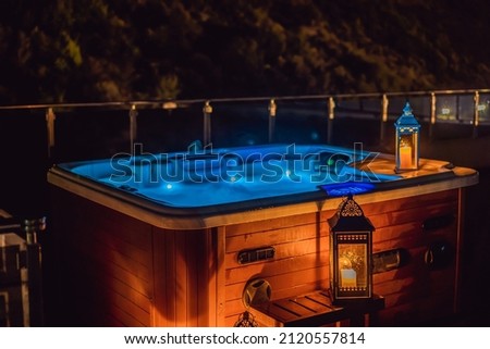 Hot tub with candles ready to take a bath. Valentines day concept Royalty-Free Stock Photo #2120557814