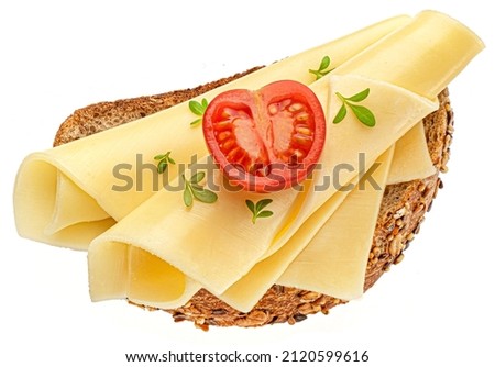 Gouda cheese slices on rye bread isolated, top view Royalty-Free Stock Photo #2120599616