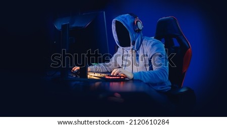 Concept banner anonymous hacking, malware or gamer playing online games computer, neon dark color. Royalty-Free Stock Photo #2120610284