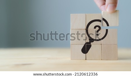 Problems and root cause analysis concept. Define problems to find solution. The wooden cubes with illustration magnifying glass to analyze question mark sign on grey background and copy space. Royalty-Free Stock Photo #2120612336
