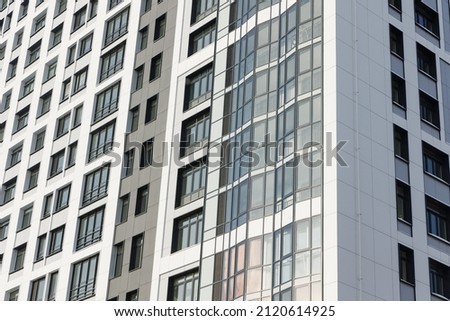 building facade with ventilated facade tiles installed. Modern architectural solutions Royalty-Free Stock Photo #2120614925