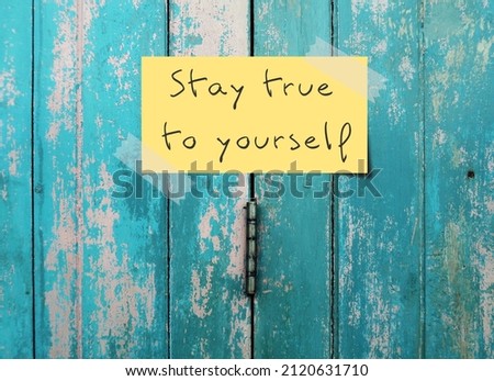 Old vintage blue door background with handwritten text - STAY TRUE TO YOURSELF means to have self awareness, knowing your own values, beliefs, preferences and be who you actually are Royalty-Free Stock Photo #2120631710