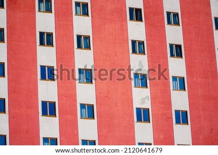 Windows of a building. A group of windows on the building. Abstract architectural background. Houses in the building. Flats in the building.