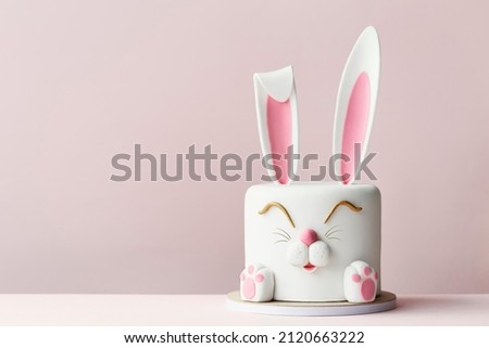 Easter bunny celebration cake on a pink background Royalty-Free Stock Photo #2120663222