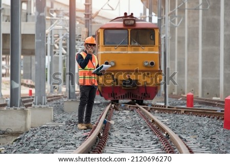 engineer standing on railway inspection on Locomotive background. construction worker on railways. Engineer work on railway.rail,engineer,Infrastructure Royalty-Free Stock Photo #2120696270