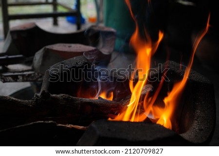 abstract blur of flames, fire burning wood in stove, Asian traditional cooking stove (Selective focus )