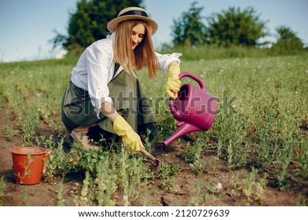 Beautiful woman in a summer field