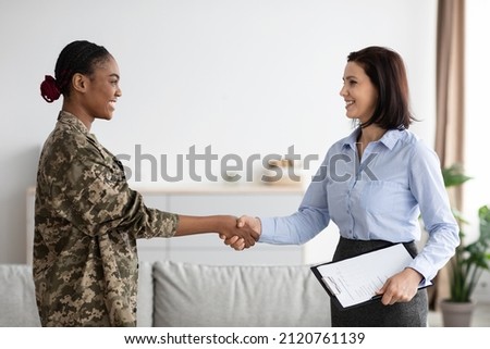 Female Therapist And Happy Black Soldier Woman Handshaking In Office After Meeting, Smiling African American Military Lady Wearing Uniform Grateful To Counselor For Successful Therapy, Copy Space Royalty-Free Stock Photo #2120761139